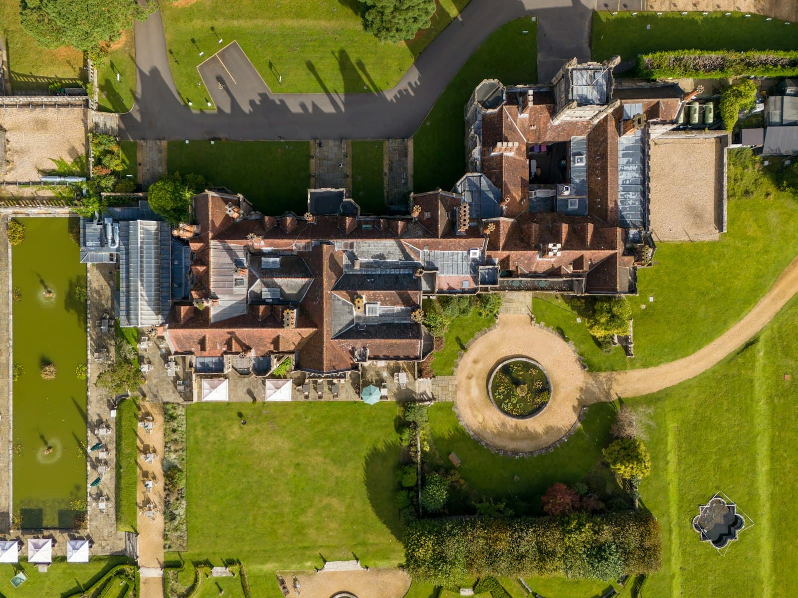 Top-down aerial view of a manor house and driveway